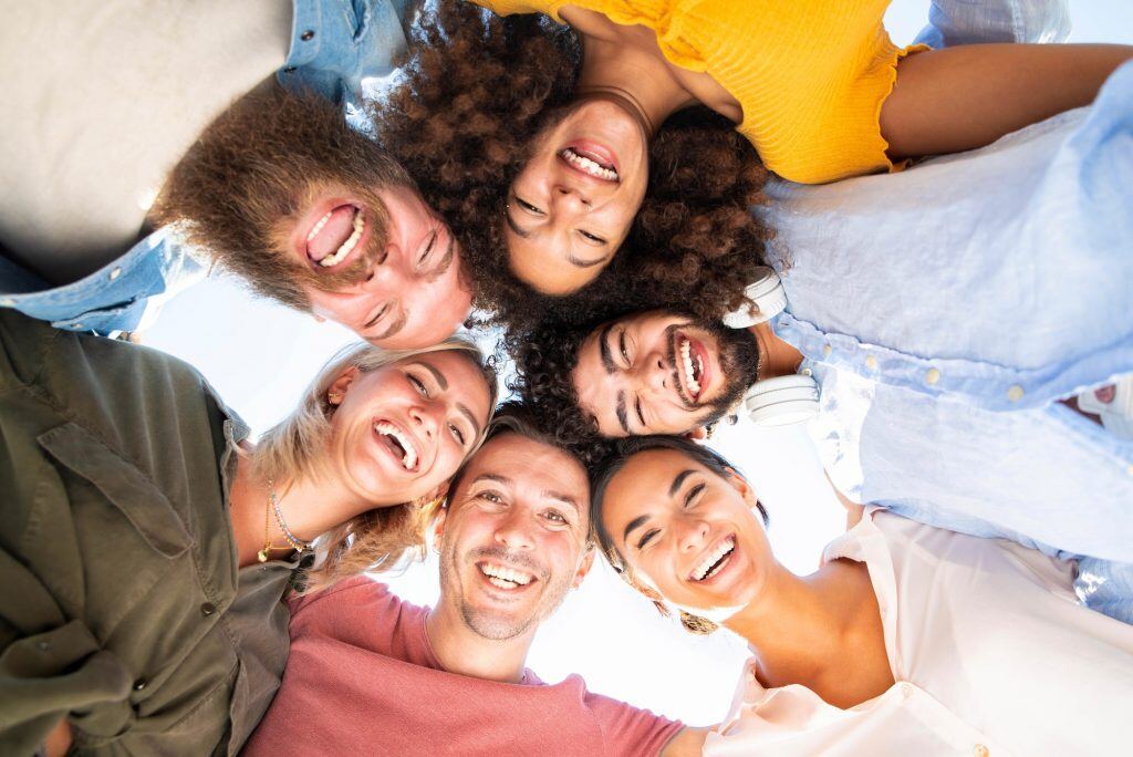 multicultural-group-of-friends-in-circle-1024x684